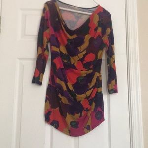 A cute shirt that makes cute ruffles on you. With mixed colors.